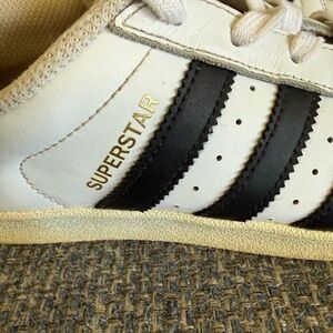 adidas White Leather Sneakers with Black Stripes and Gold Accent